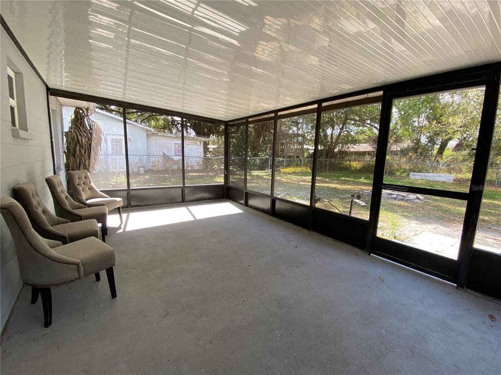 39656 Meadowood Loop Zephyrhills, FL 33542 - Photo 23 of 30 a view of a hallway with a large window