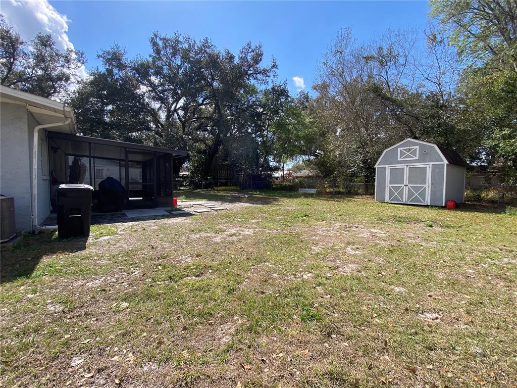 39656 Meadowood Loop Zephyrhills, FL 33542 - Photo 26 of 30 a view of a house with a yard