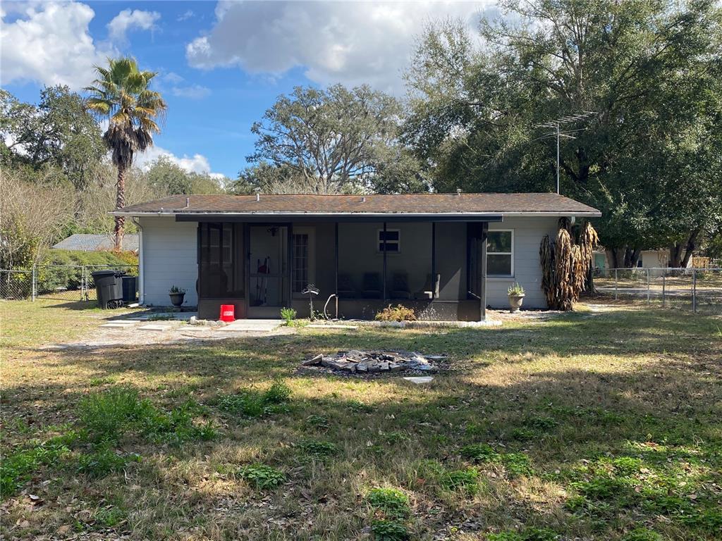 39656 Meadowood Loop Zephyrhills, FL 33542 - Photo 28 of 30 a view of a house with backyard and sitting area