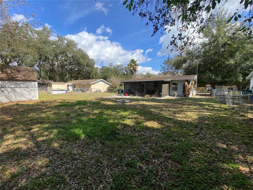 39656 Meadowood Loop Zephyrhills, FL 33542 - Photo 29 of 30 a view of a house with a big yard
