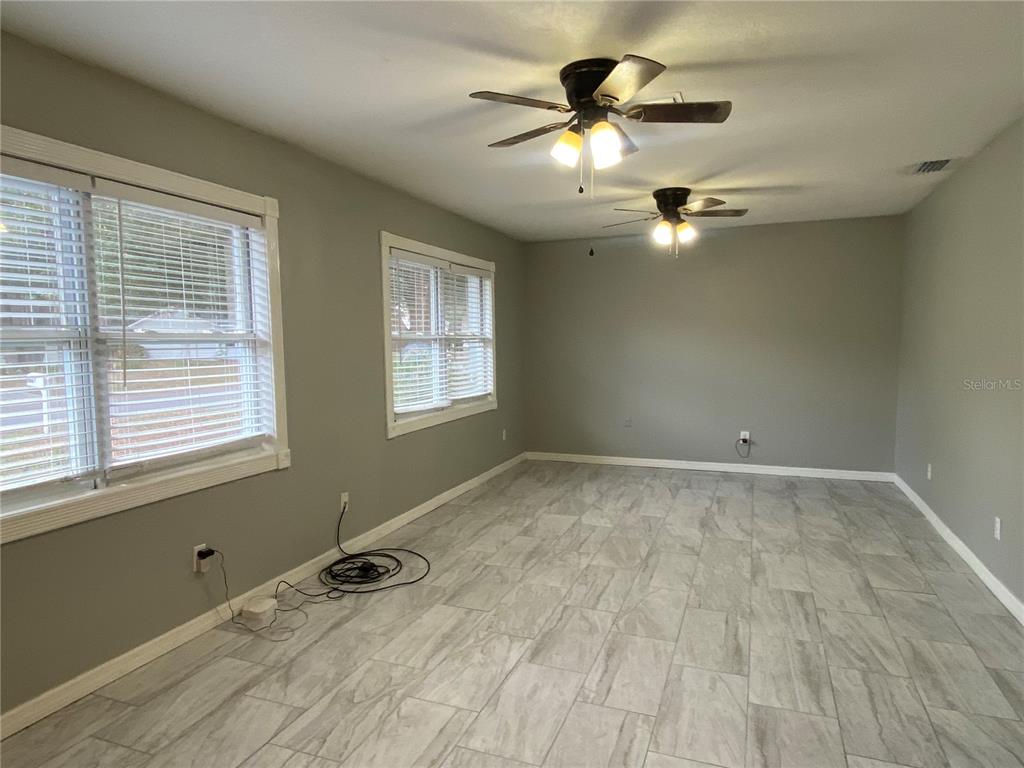 39656 Meadowood Loop Zephyrhills, FL 33542 - Photo 5 of 30 a view of an empty room with a window
