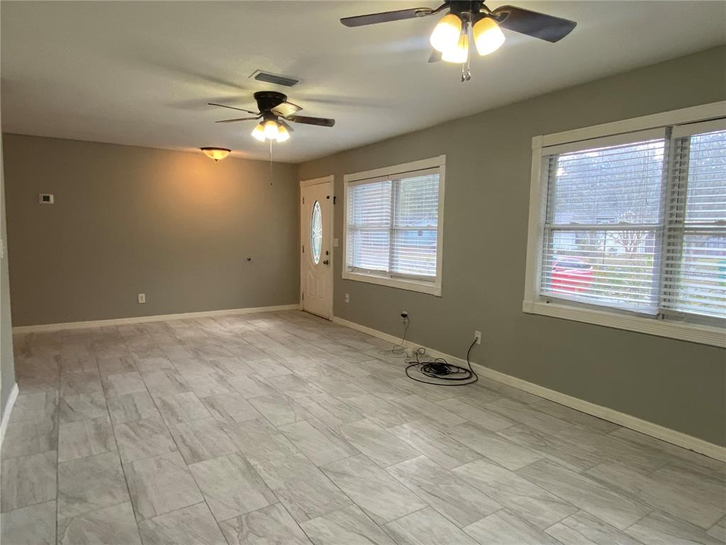 39656 Meadowood Loop Zephyrhills, FL 33542 - Photo 7 of 30 a view of a room with a ceiling fan and window