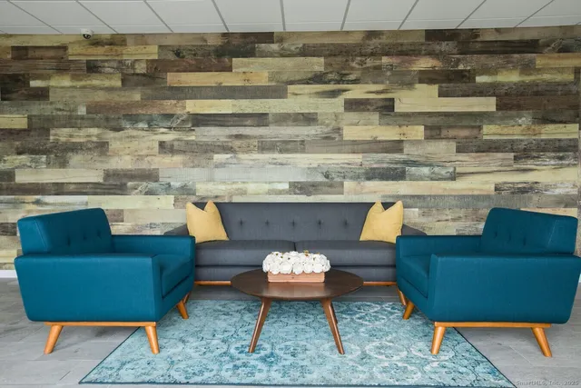 a living room with furniture and a rug