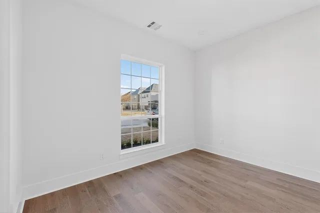 a view of cabinets and wooden floor