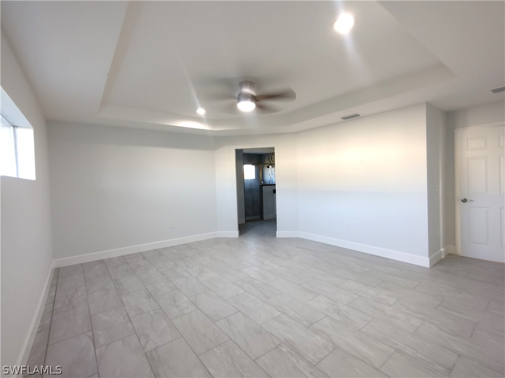 527 David Circle LaBelle, FL 33935 - Photo 11 of 35 an empty room with an entryway and kitchen view