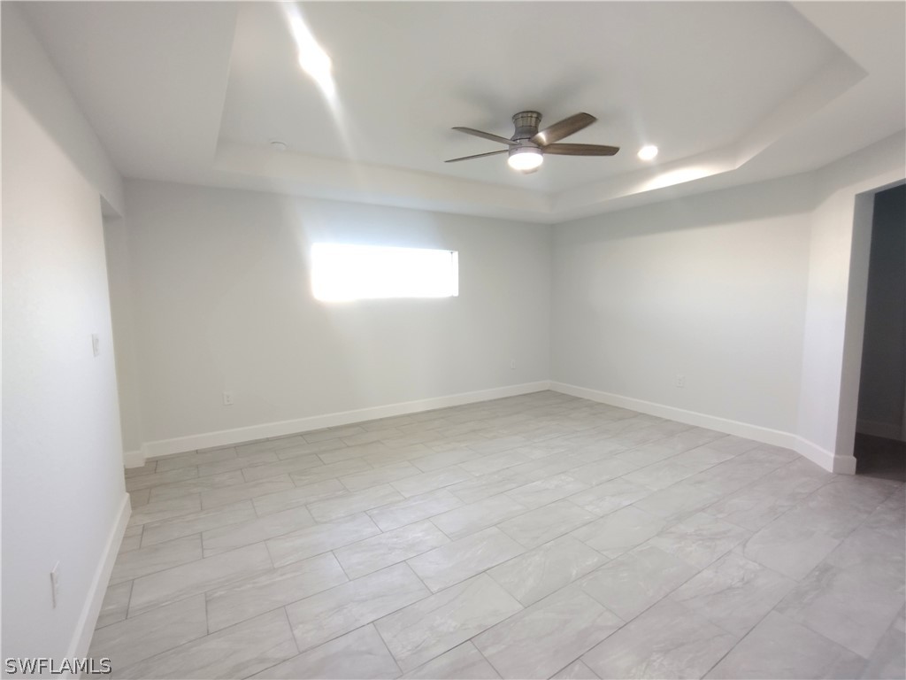 527 David Circle LaBelle, FL 33935 - Photo 13 of 35 an empty room with a fan & a window