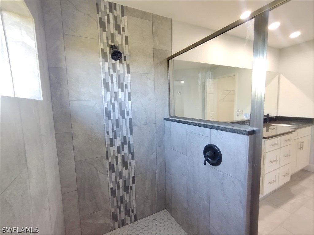 527 David Circle LaBelle, FL 33935 - Photo 18 of 35 a bathroom with a shower and a sink