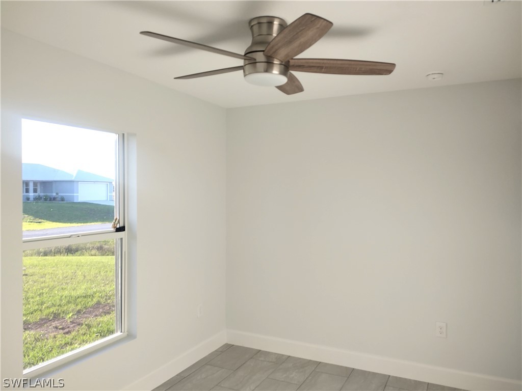 527 David Circle LaBelle, FL 33935 - Photo 20 of 35 a view of a room with a window and a ceiling fan