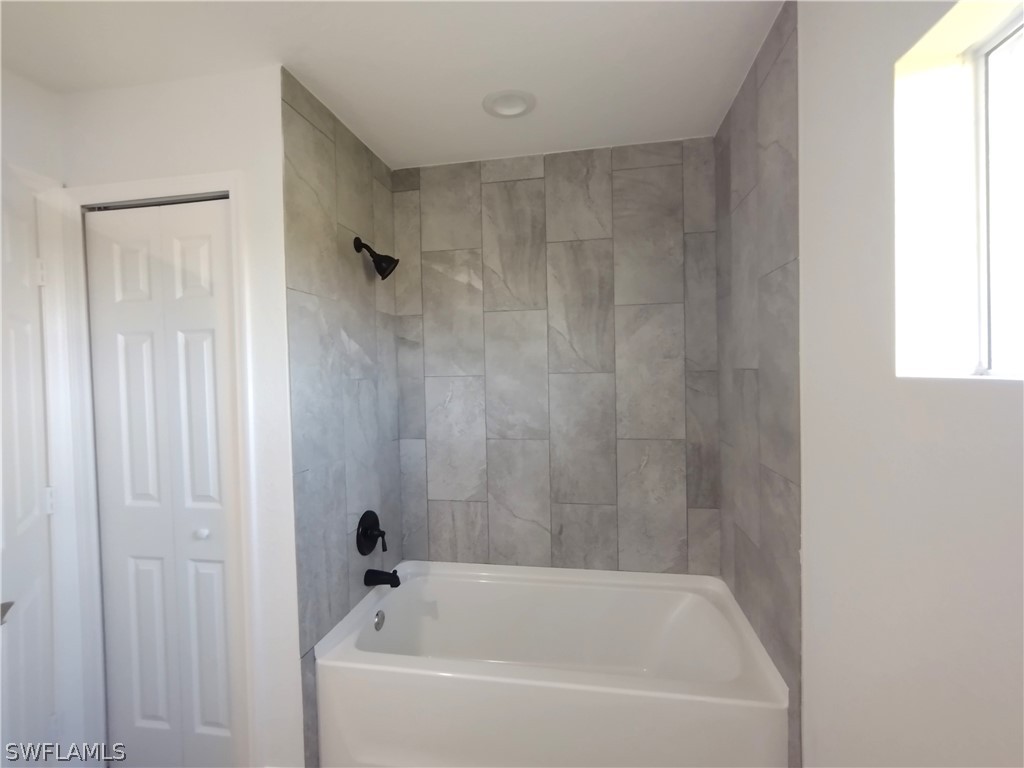 527 David Circle LaBelle, FL 33935 - Photo 24 of 35 a white bath tub sitting next to a shower