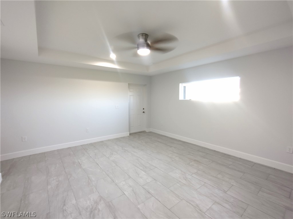 527 David Circle LaBelle, FL 33935 - Photo 10 of 35 an empty room with a empty space and windows