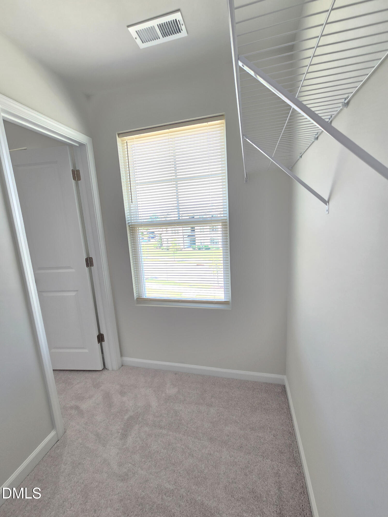 2431 Kasota Lane Raleigh, NC 27610 - Photo 42 of 46 an empty room with windows