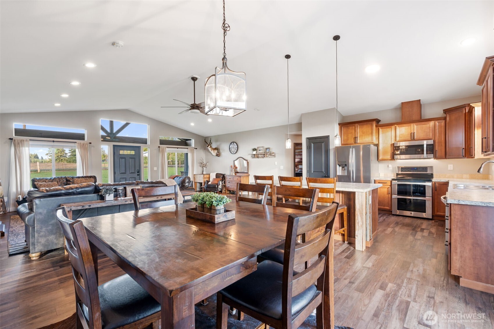 107 Haight Road Chehalis, WA 98532 - Photo 12 of 39 a view of a dining room and livingroom with furniture wooden floor a chandelier