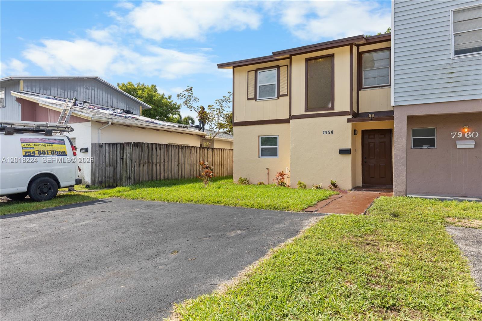 7958 Southwest 6th Street Pompano Beach, FL 33068 - Photo 5 of 57 a view of a house with a yard and garage