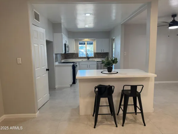an empty room with windows and entrance