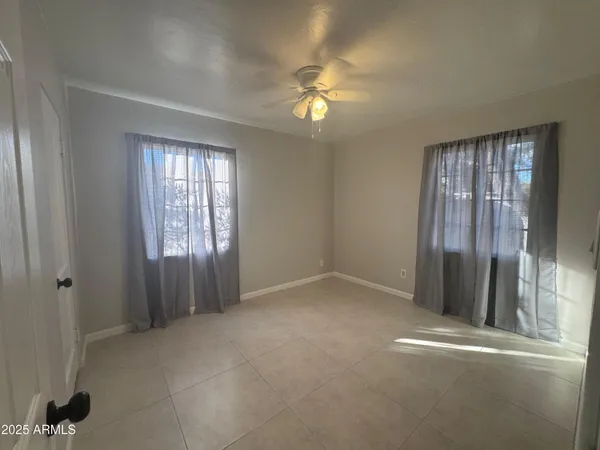 a bathroom with a shower and a toilet