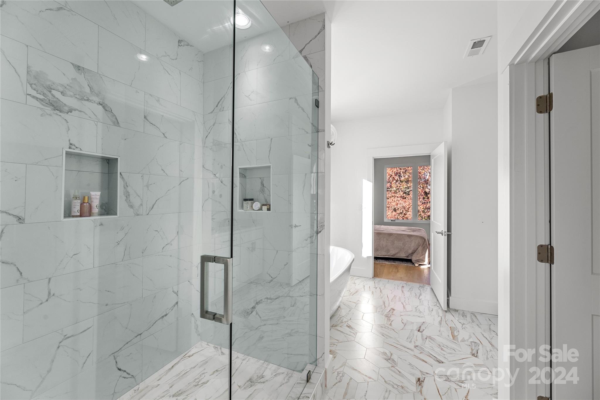 3704 Tuckaseegee Road Charlotte, NC 28208 - Photo 26 of 39 a en suite bathroom with a shower