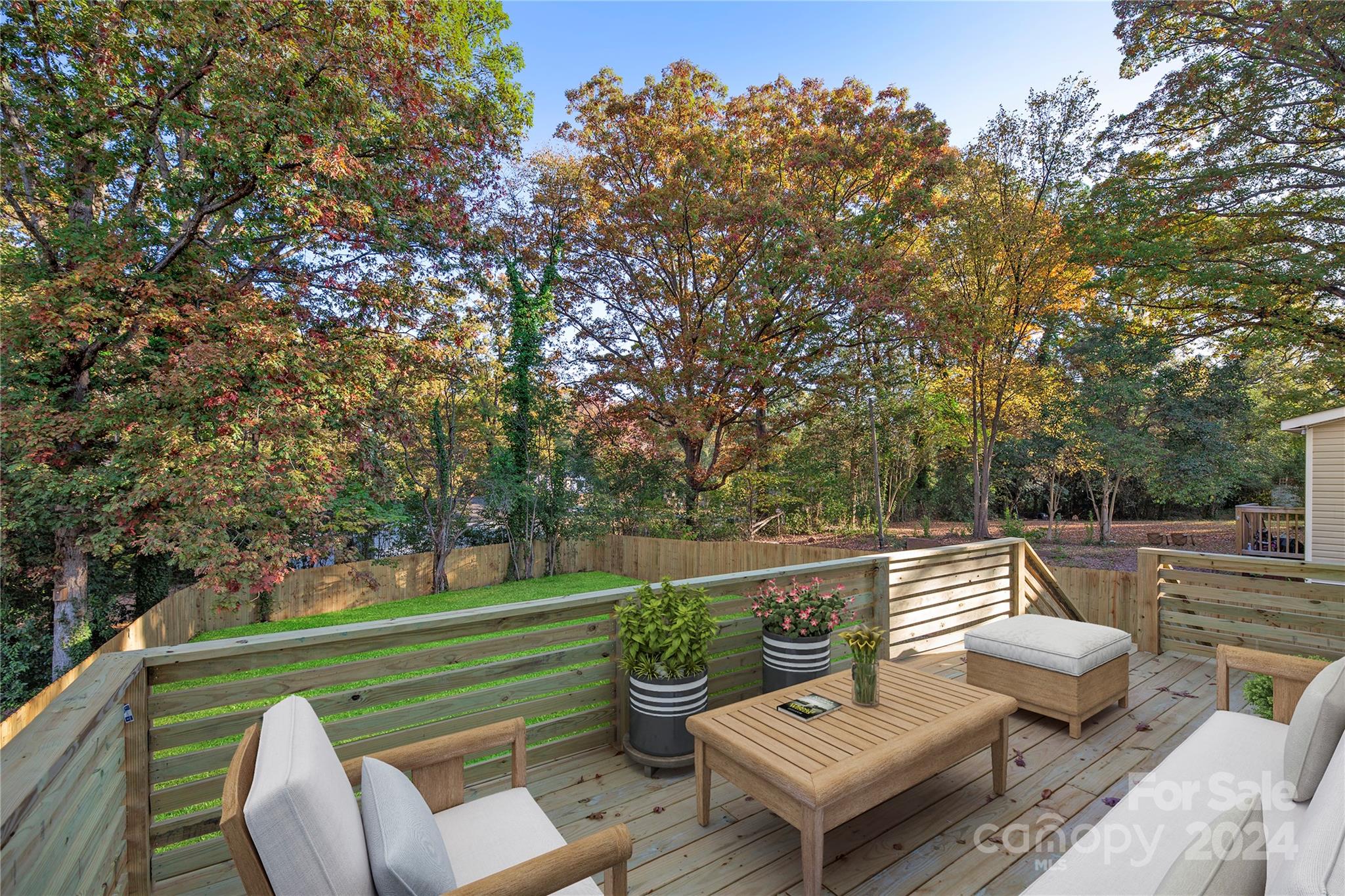 3704 Tuckaseegee Road Charlotte, NC 28208 - Photo 38 of 39 a view of a patio with couple of chairs and a fire pit