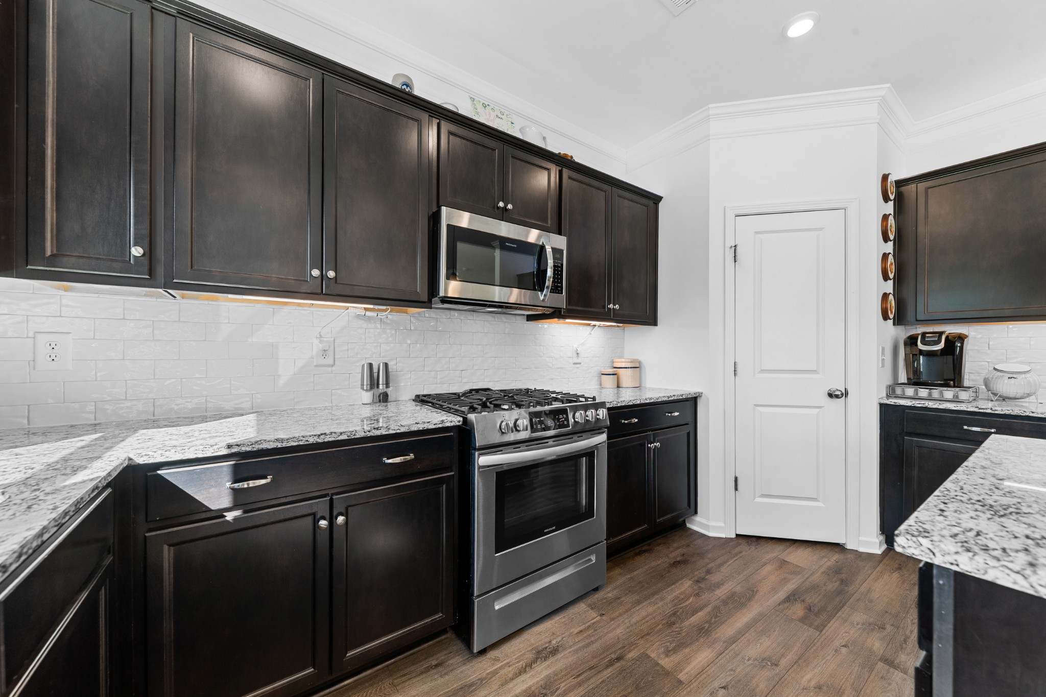 229 Stonewall Road Columbia, TN 38401 - Photo 15 of 61 a kitchen with granite countertop wooden cabinets stainless steel appliances and a granite counter tops