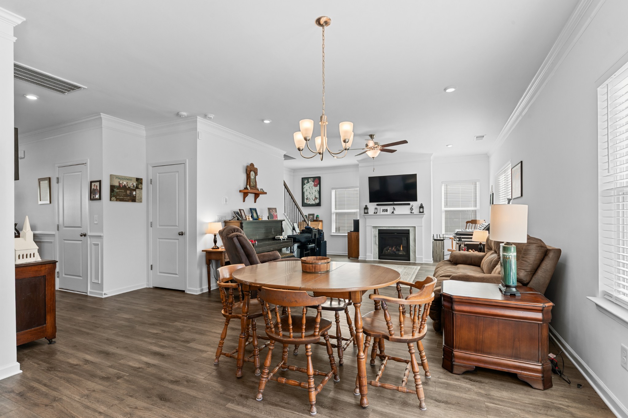 229 Stonewall Road Columbia, TN 38401 - Photo 22 of 61 a view of a dining room with furniture wooden floor and a chandelier