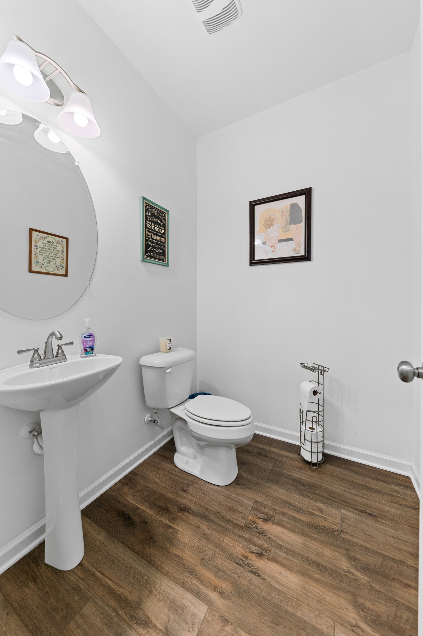 229 Stonewall Road Columbia, TN 38401 - Photo 27 of 61 a bathroom with a toilet a sink and mirror