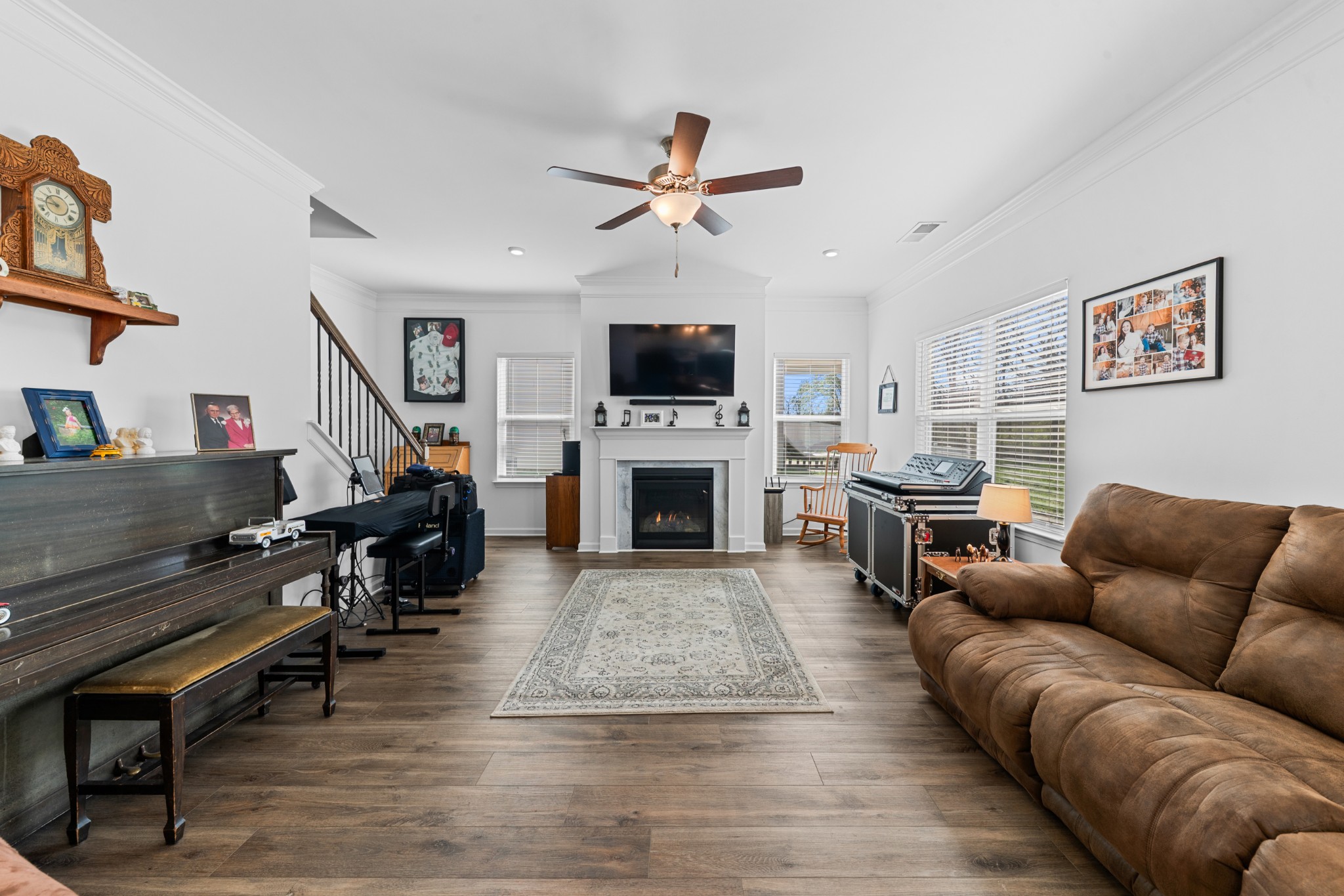 229 Stonewall Road Columbia, TN 38401 - Photo 28 of 61 a living room with furniture a flat screen tv and a fireplace