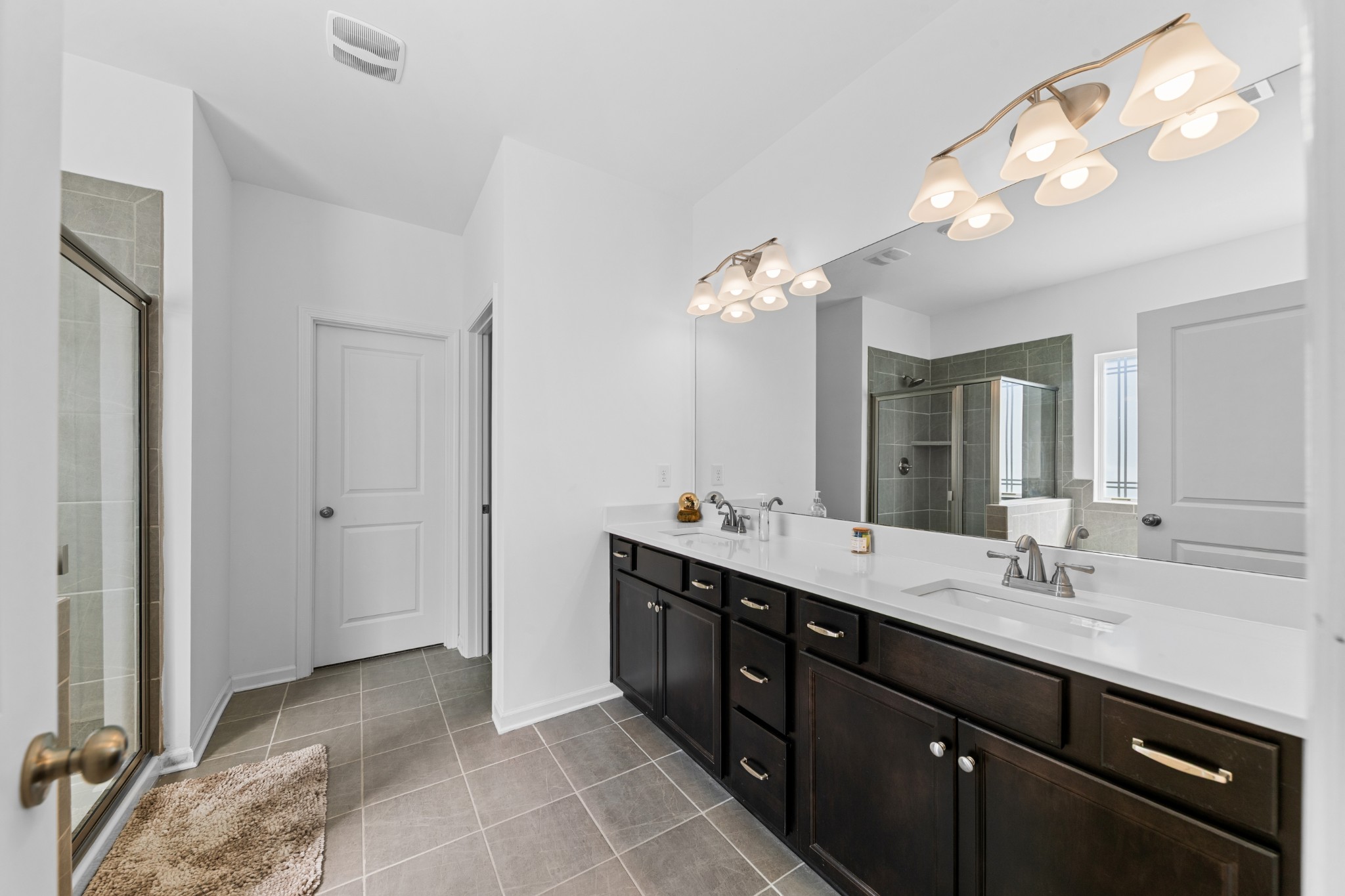 229 Stonewall Road Columbia, TN 38401 - Photo 35 of 61 a spacious bathroom with a double vanity sink and a mirror