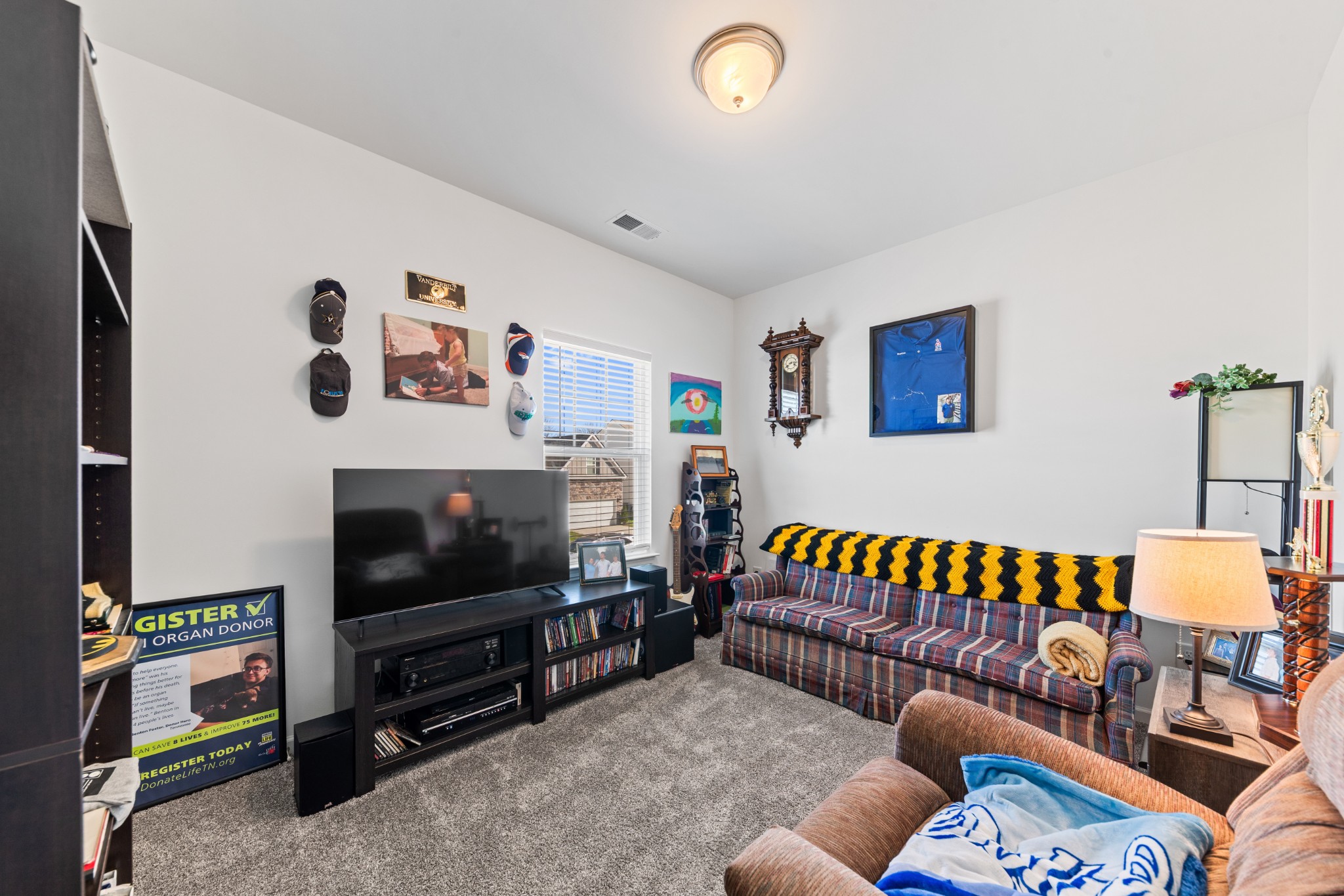 229 Stonewall Road Columbia, TN 38401 - Photo 48 of 61 a living room with furniture and a flat screen tv