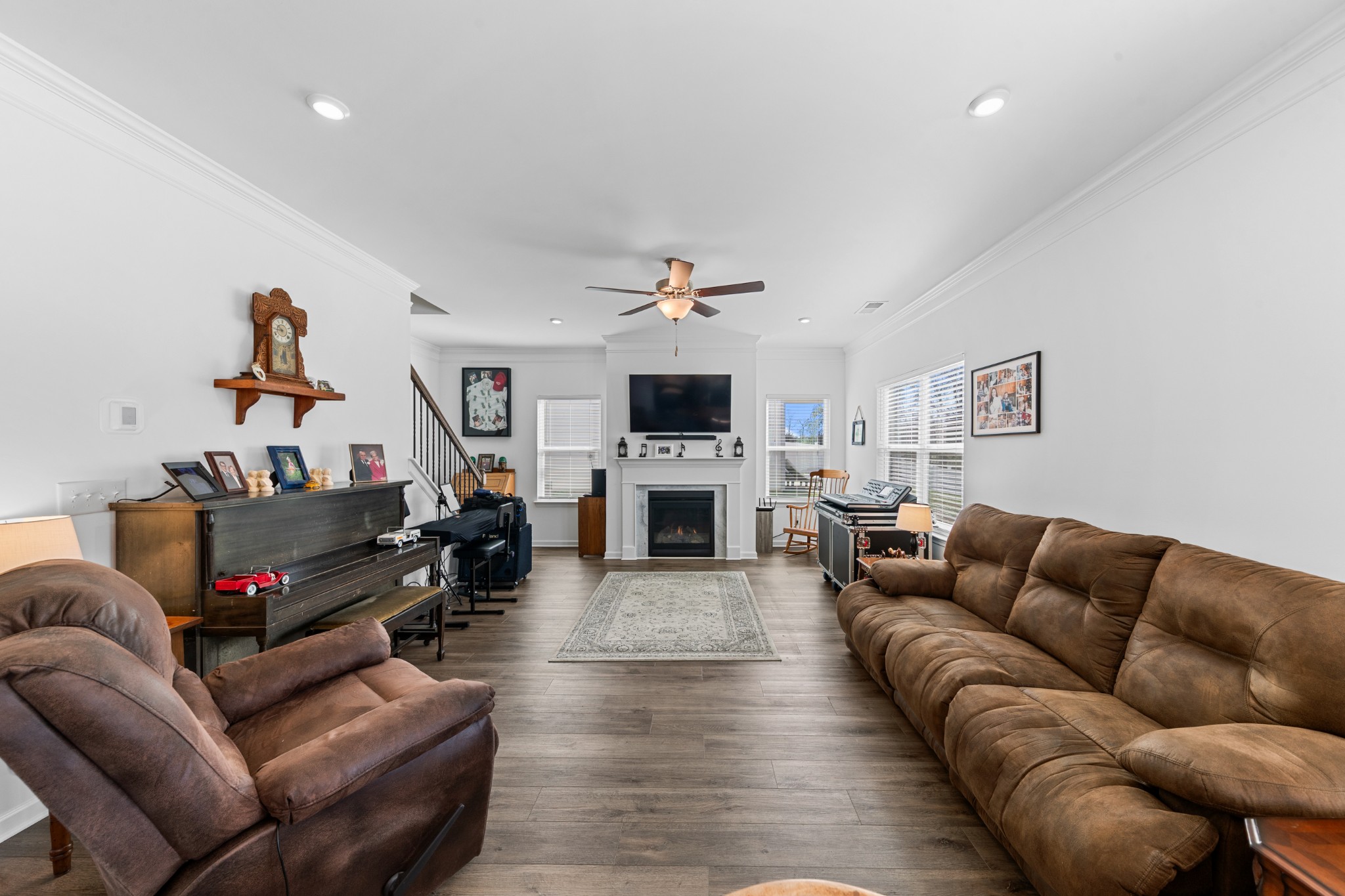 229 Stonewall Road Columbia, TN 38401 - Photo 6 of 61 a living room with furniture a fireplace and a flat screen tv