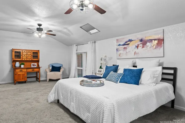 a bedroom with bed and window