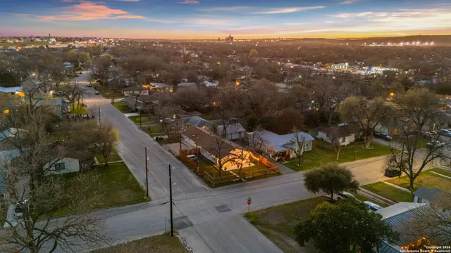 an aerial view of residential houses with outdoor space