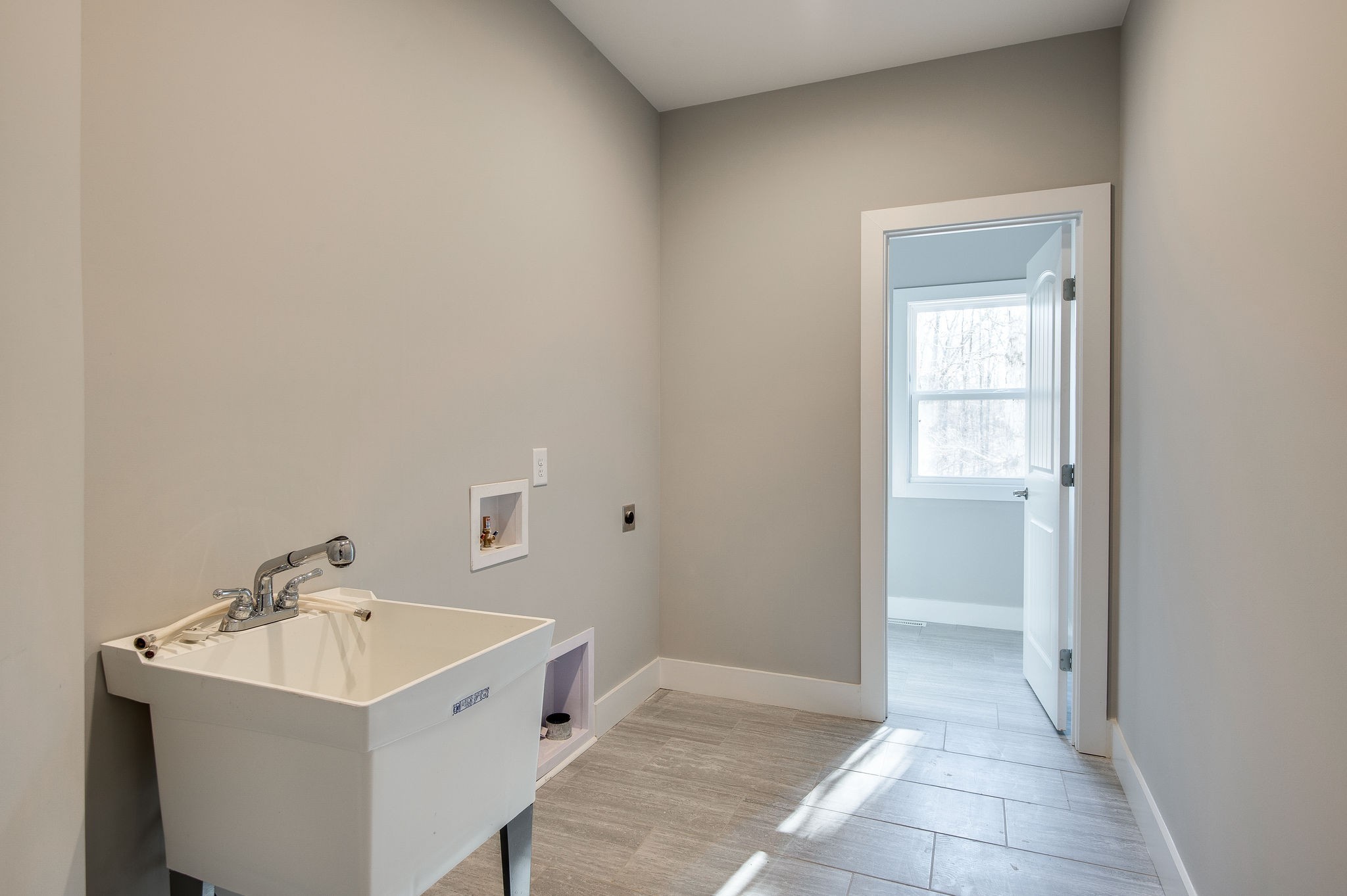 7936 Crow Cut Road Northwest Fairview, TN 37062 - Photo 21 of 36 LAUNDRY ROOM W/ SINK AND WASHER/DRYER HOOKUPS IN CONVENIENT LOCATION. (pic from previous list)
