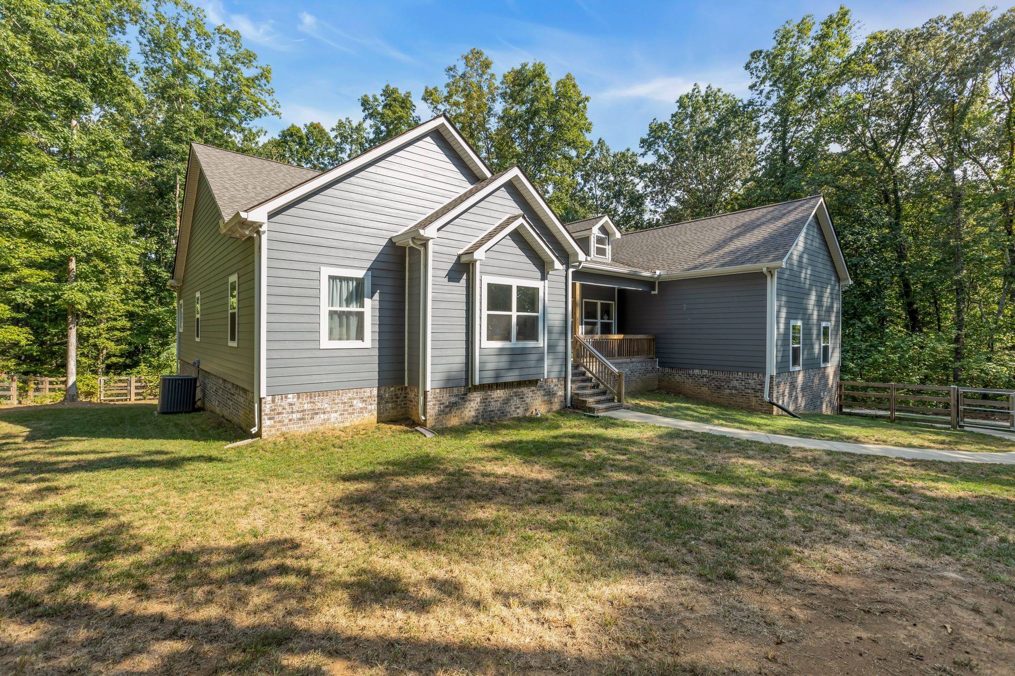 7936 Crow Cut Road Northwest Fairview, TN 37062 - Photo 3 of 36 LEVEL, FENCED YARD, PERFECT FOR FURRY FRIENDS AND SWINGSETS!