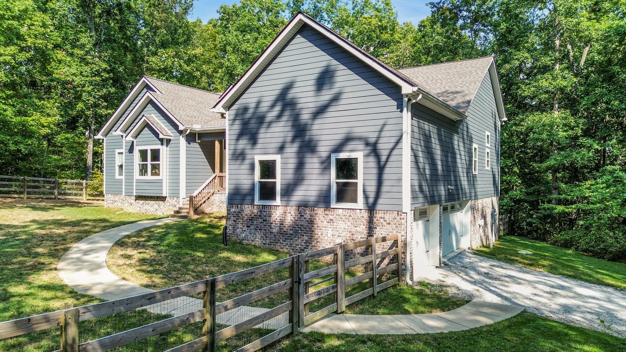 7936 Crow Cut Road Northwest Fairview, TN 37062 - Photo 4 of 36 VIEW OF SIDE ENTRY GATE AND GARAGE ENTRY.