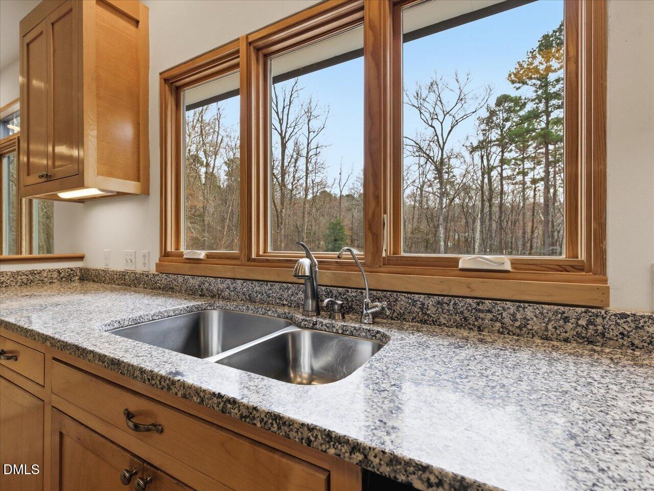 67 Bingham Ridge Drive Pittsboro, NC 27312 - Photo 16 of 82 a kitchen with a sink and a large window
