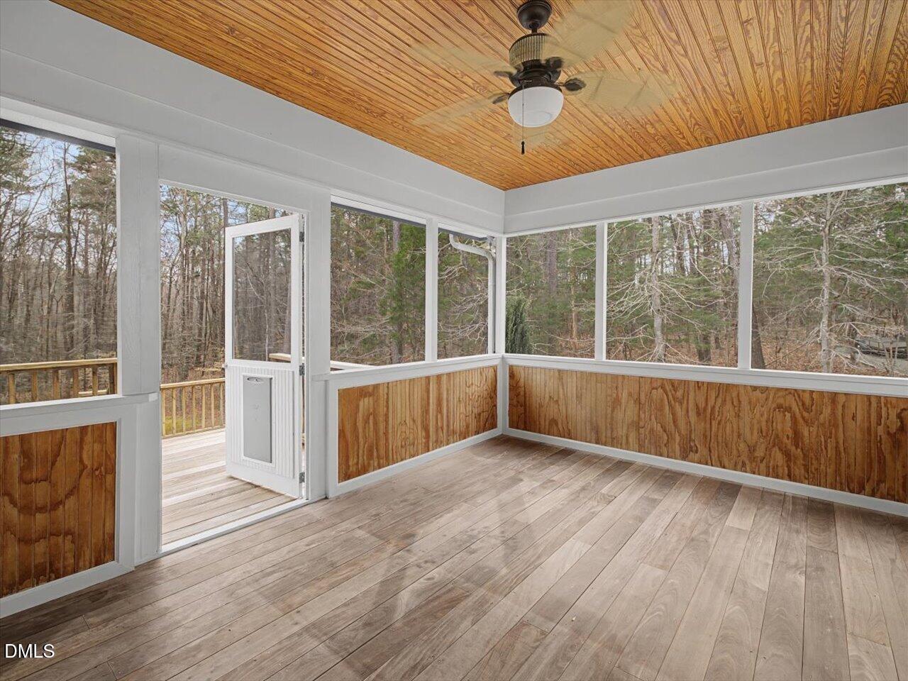 67 Bingham Ridge Drive Pittsboro, NC 27312 - Photo 27 of 82 a view of an empty room with a window and wooden floor