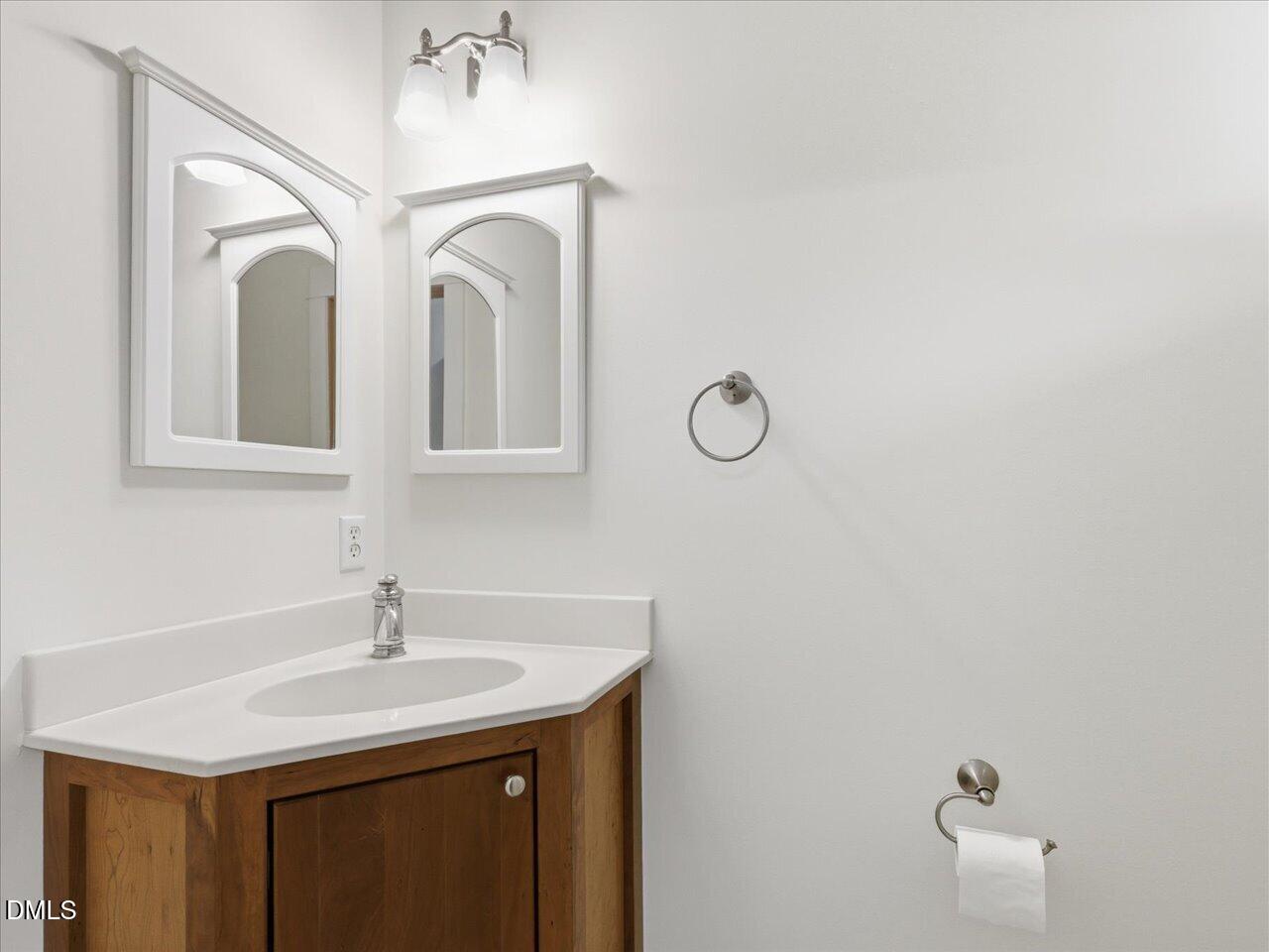 67 Bingham Ridge Drive Pittsboro, NC 27312 - Photo 33 of 82 a bathroom with a sink and a mirror