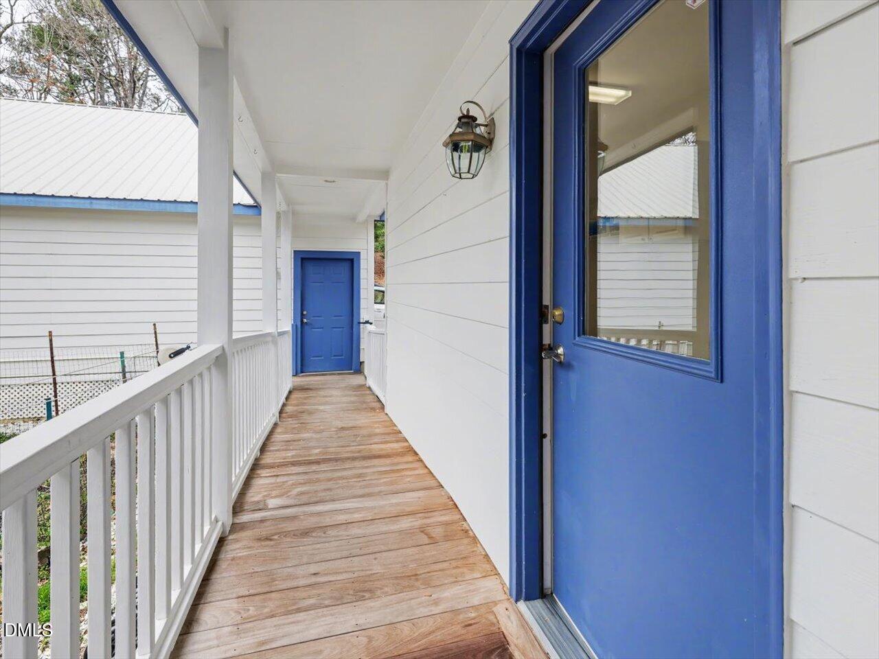 67 Bingham Ridge Drive Pittsboro, NC 27312 - Photo 36 of 82 a view of a balcony with wooden floor and stairs