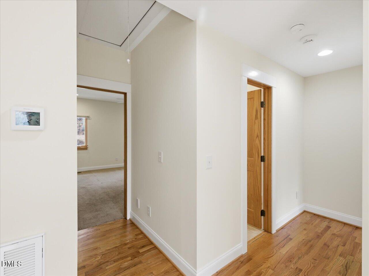 67 Bingham Ridge Drive Pittsboro, NC 27312 - Photo 37 of 82 a view of hallway with wooden floor