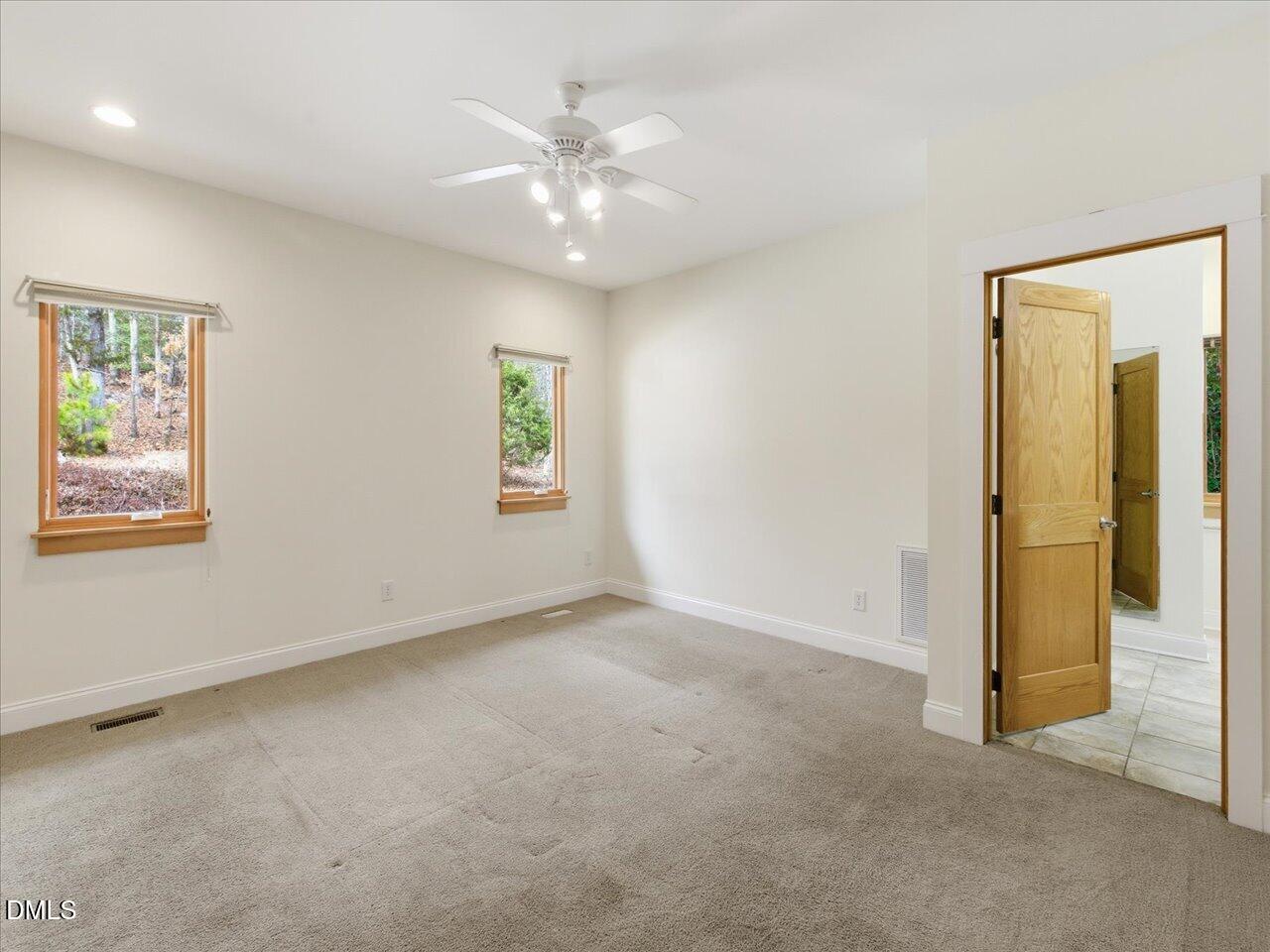 67 Bingham Ridge Drive Pittsboro, NC 27312 - Photo 38 of 82 an empty room with windows and closet