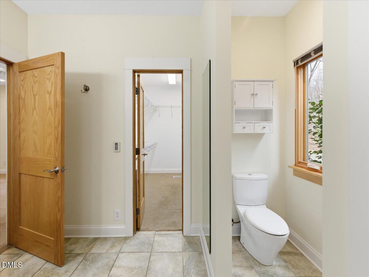 67 Bingham Ridge Drive Pittsboro, NC 27312 - Photo 44 of 82 a bathroom with a granite countertop toilet and a shower