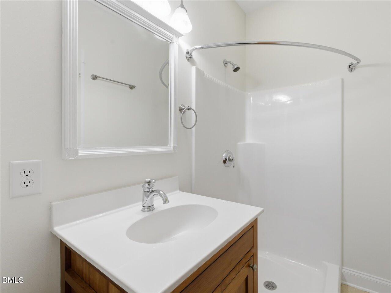 67 Bingham Ridge Drive Pittsboro, NC 27312 - Photo 49 of 82 a bathroom with a sink and a mirror