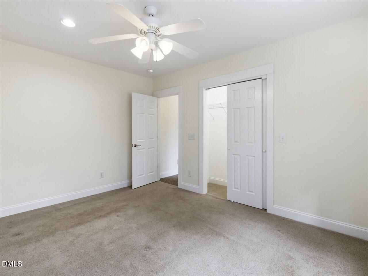 67 Bingham Ridge Drive Pittsboro, NC 27312 - Photo 55 of 82 an empty room with chandelier fan