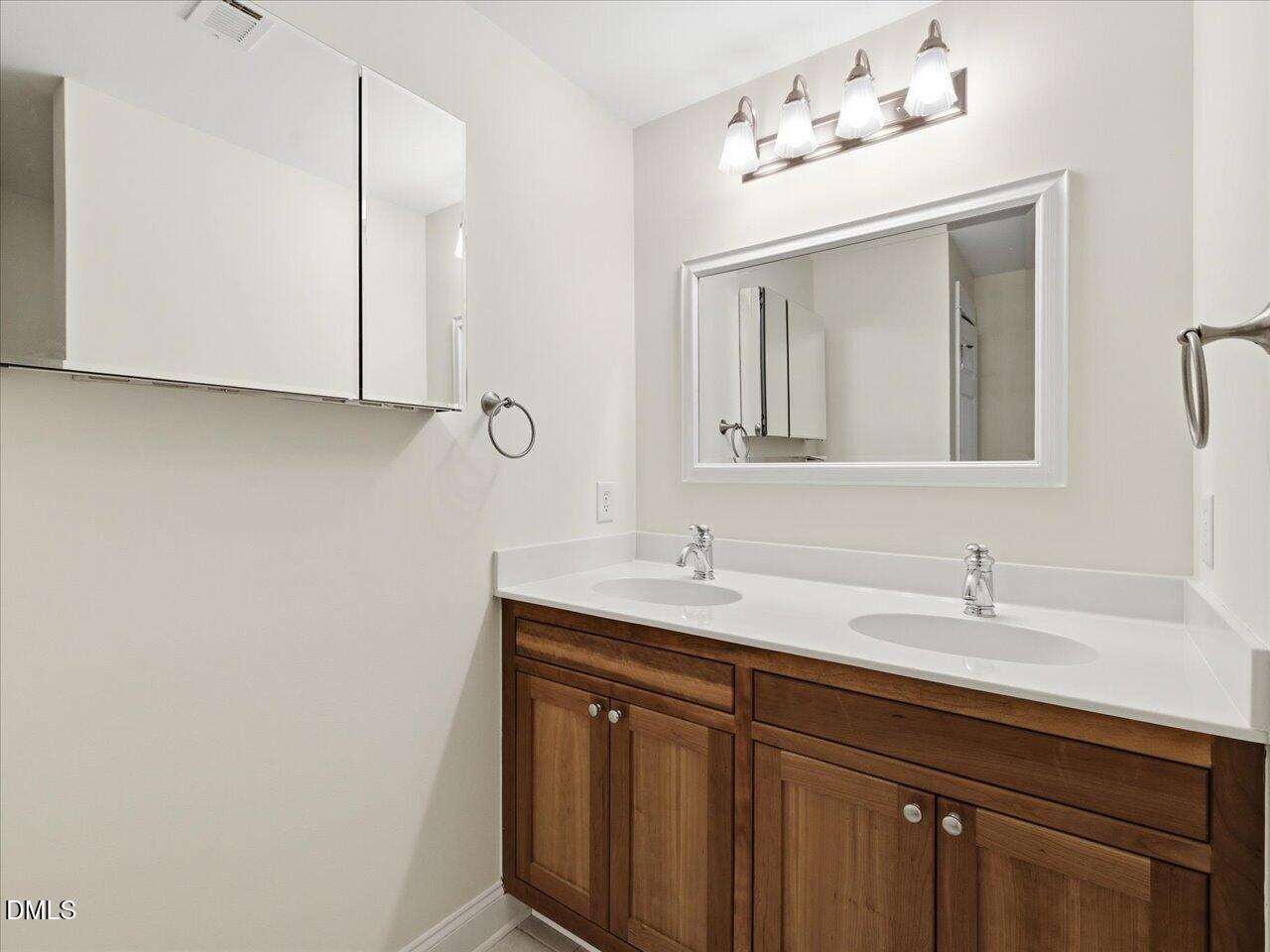 67 Bingham Ridge Drive Pittsboro, NC 27312 - Photo 56 of 82 a bathroom with a sink and a mirror