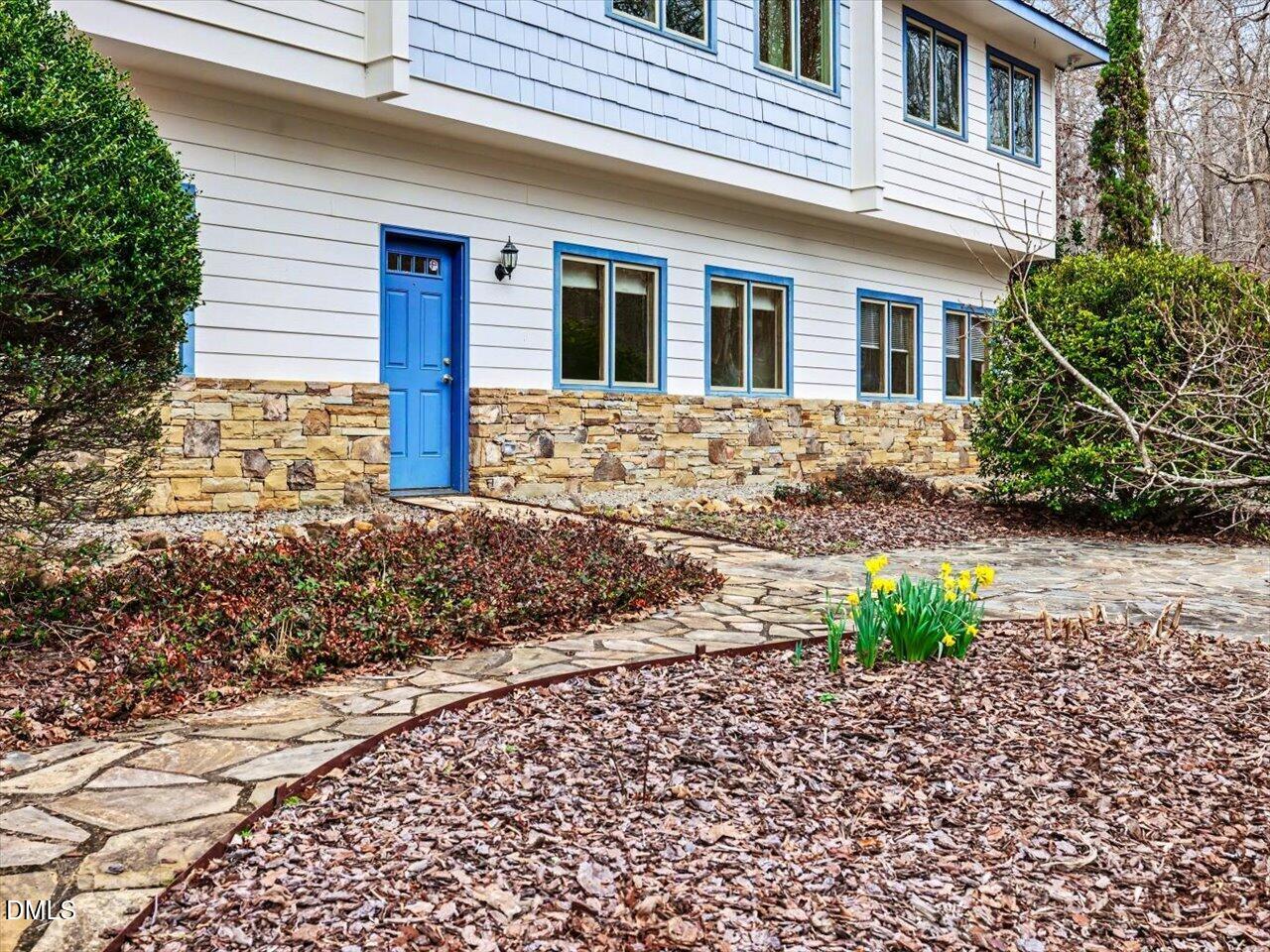 67 Bingham Ridge Drive Pittsboro, NC 27312 - Photo 64 of 82 a front view of a house with a garden