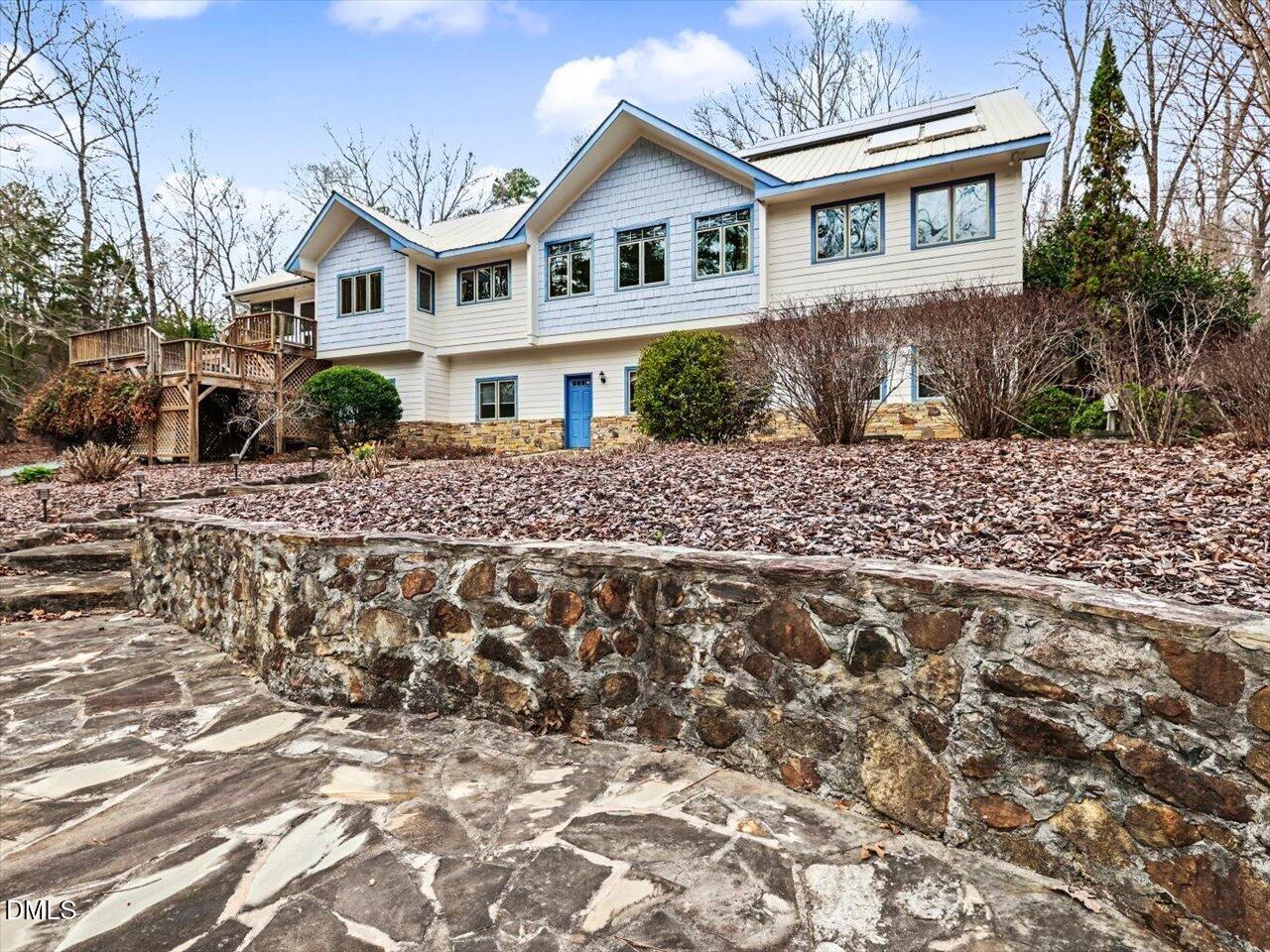 67 Bingham Ridge Drive Pittsboro, NC 27312 - Photo 67 of 82 a front view of a house with a garden