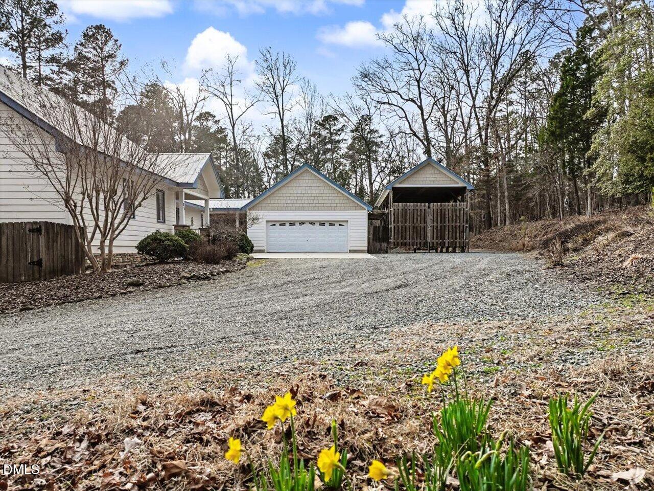 67 Bingham Ridge Drive Pittsboro, NC 27312 - Photo 73 of 82 a front view of a house with a garden