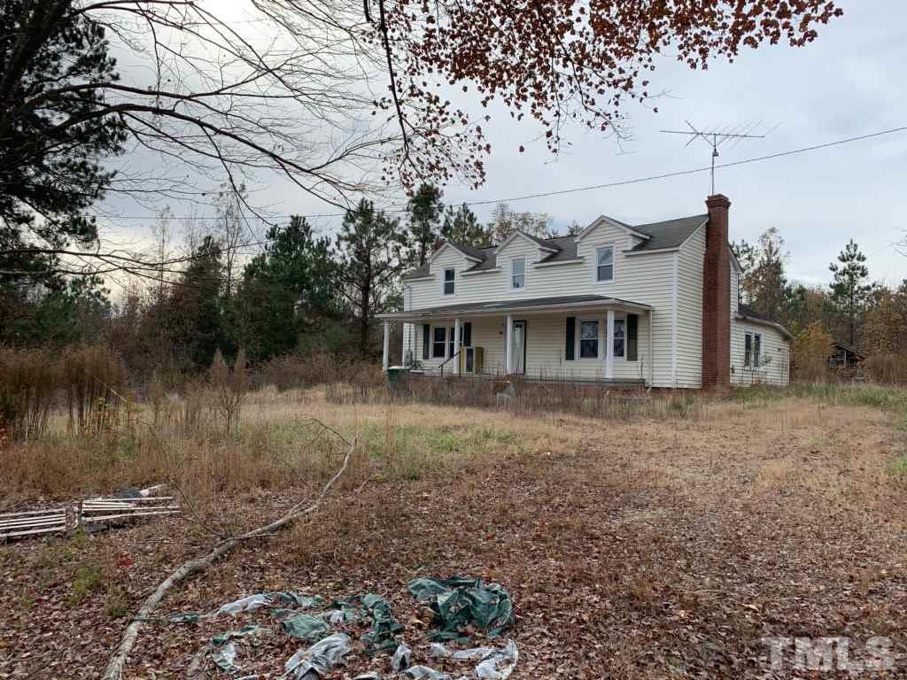 121 Archie Clayton Road Roxboro, NC 27574 - Photo 6 of 8 a view of a house with a yard
