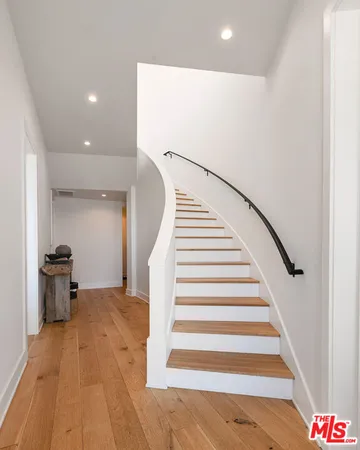 a view of a living room and a wooden floor