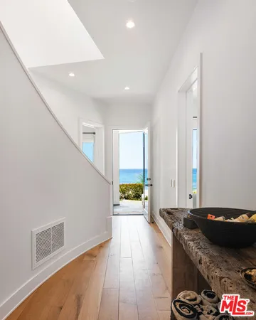 a bedroom with two beds and a large window