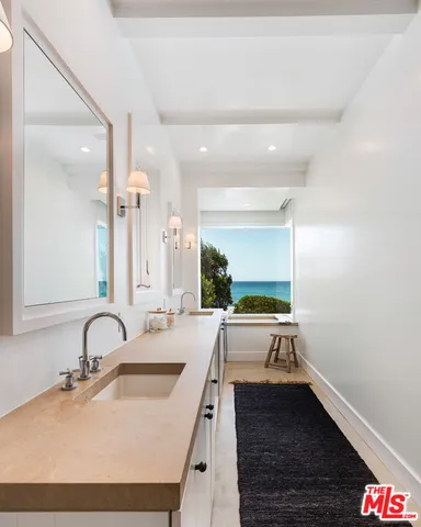 a view of a balcony with couches and a table